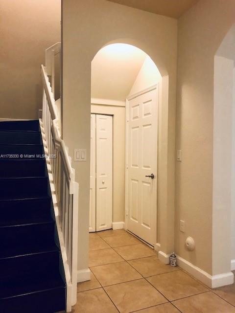 interior space with light tile patterned floors