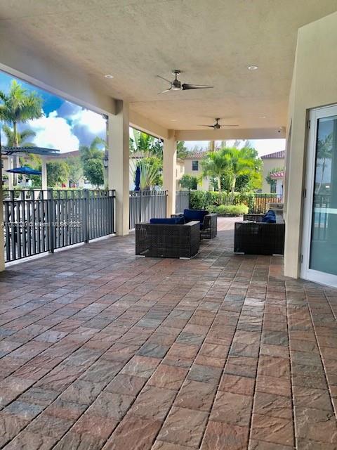 view of patio with an outdoor hangout area and ceiling fan