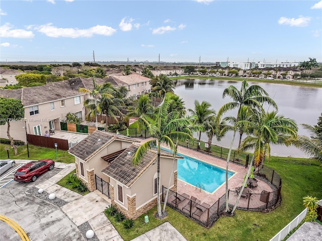 birds eye view of property with a water view