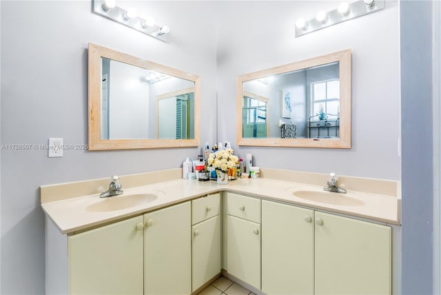 bathroom with tile patterned floors and vanity