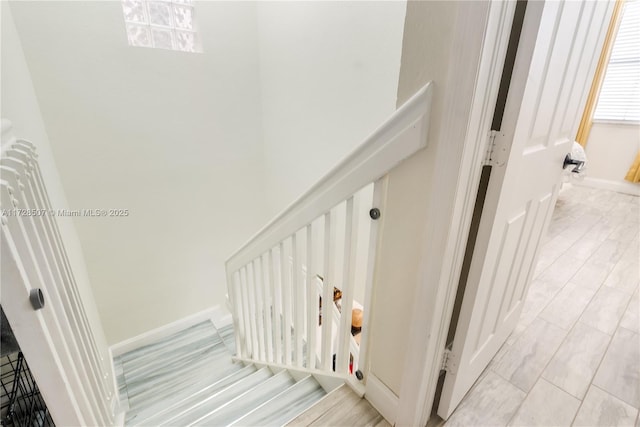 stairway featuring hardwood / wood-style floors