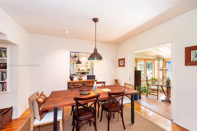 dining area with hardwood / wood-style flooring