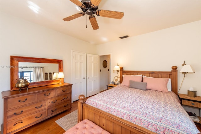 bedroom featuring ceiling fan and light hardwood / wood-style flooring