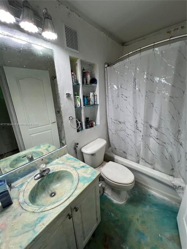 full bathroom featuring vanity, shower / bath combo with shower curtain, and toilet