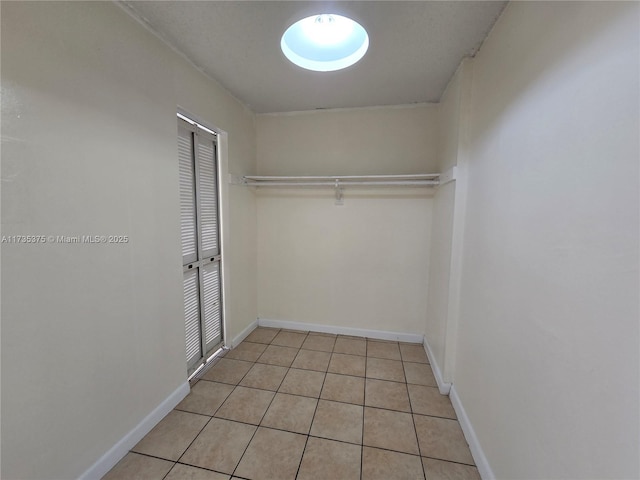 walk in closet featuring light tile patterned floors