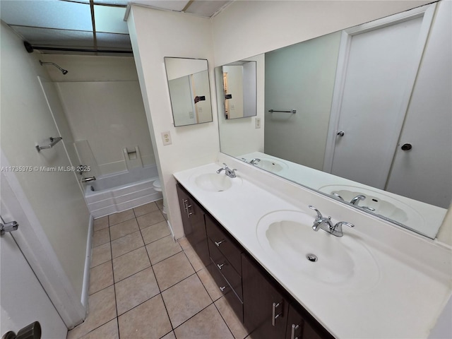 full bathroom with tile patterned flooring, vanity, shower / tub combination, and toilet