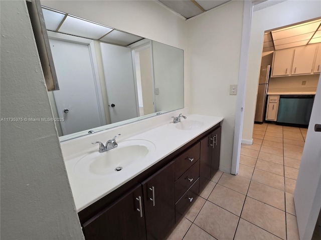 bathroom with tile patterned floors and vanity