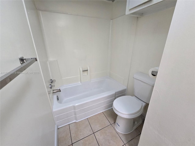 bathroom featuring tile patterned floors, toilet, and shower / washtub combination