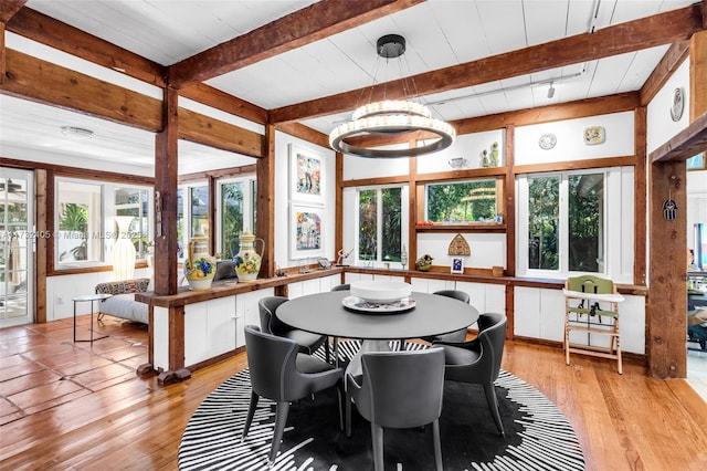 sunroom / solarium with beamed ceiling