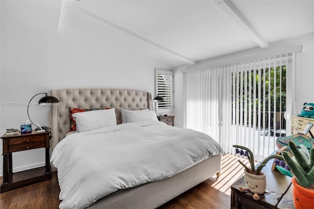 bedroom with beamed ceiling, dark wood-type flooring, access to exterior, and multiple windows