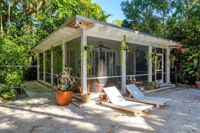 view of patio featuring a sunroom