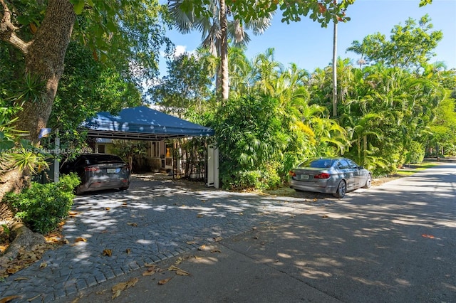 view of vehicle parking featuring a carport