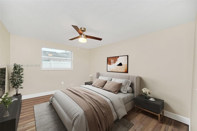 bedroom featuring ceiling fan and wood-type flooring