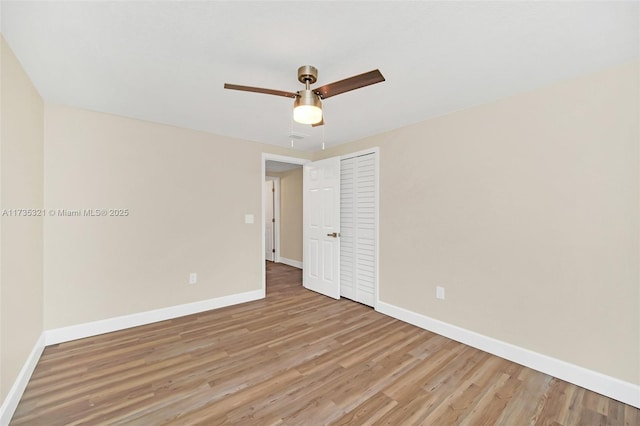 unfurnished room with light hardwood / wood-style flooring and ceiling fan