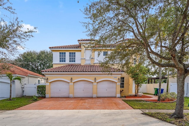 mediterranean / spanish house with a garage