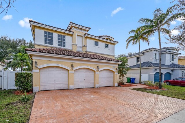 mediterranean / spanish-style home featuring a garage