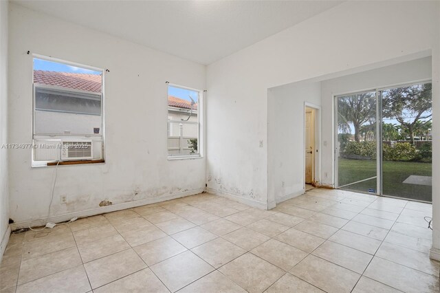 tiled spare room with cooling unit