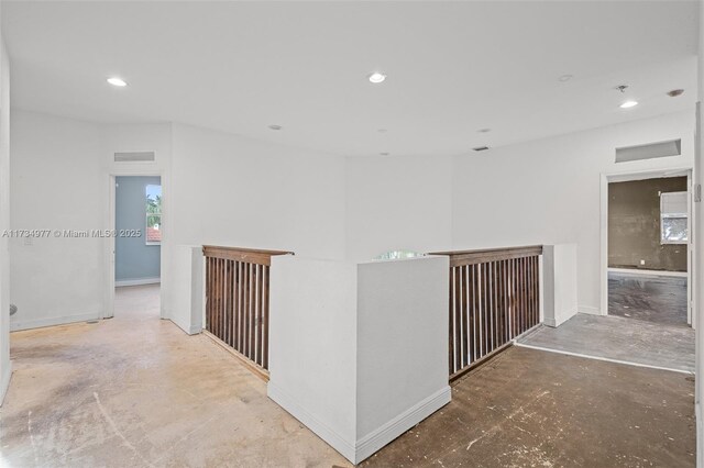 hallway featuring concrete flooring