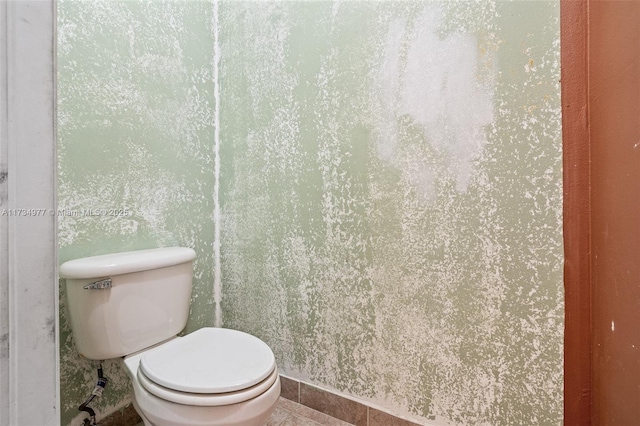 bathroom featuring tile patterned floors and toilet