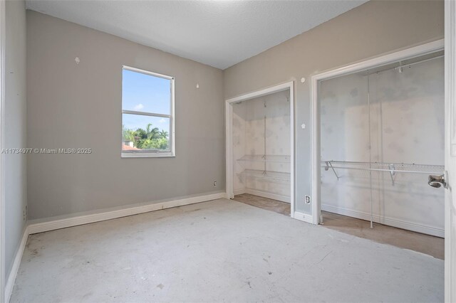 unfurnished bedroom featuring connected bathroom