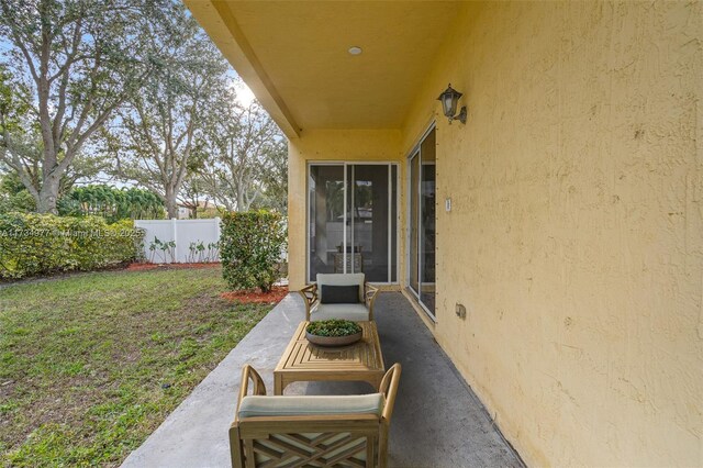 rear view of house featuring a yard and a patio