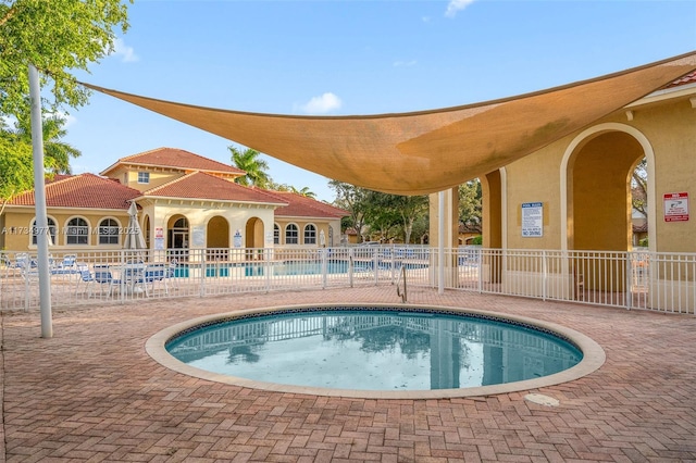 view of swimming pool with a patio