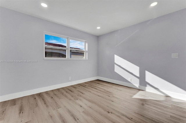 spare room with light wood-type flooring