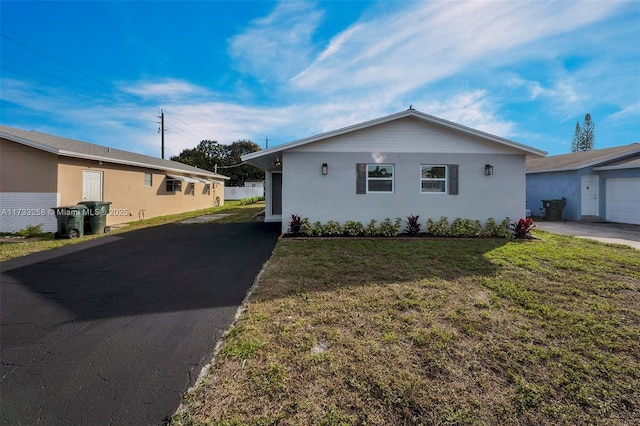 ranch-style home with a front yard