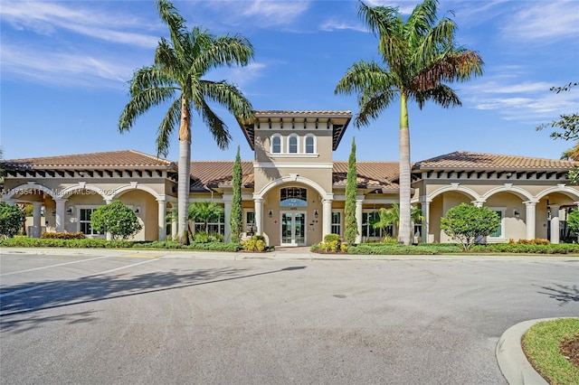 mediterranean / spanish-style house with french doors