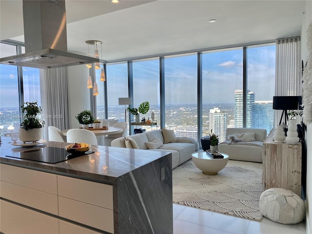 tiled living room with a wall of windows