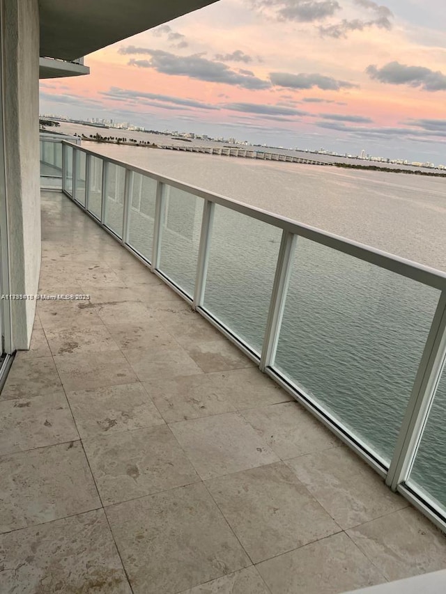 balcony at dusk with a water view