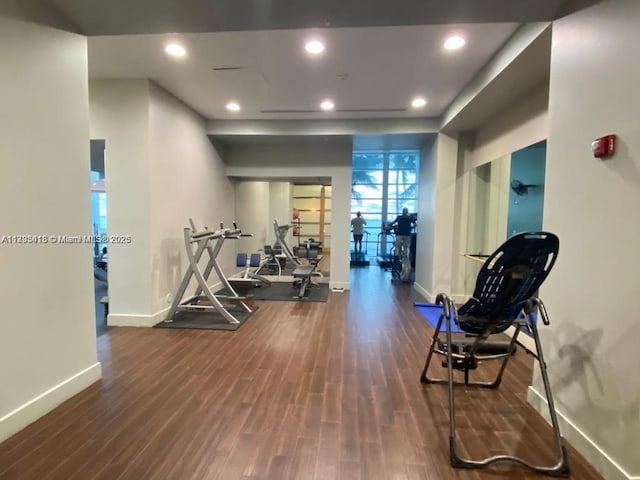 workout area with dark hardwood / wood-style flooring