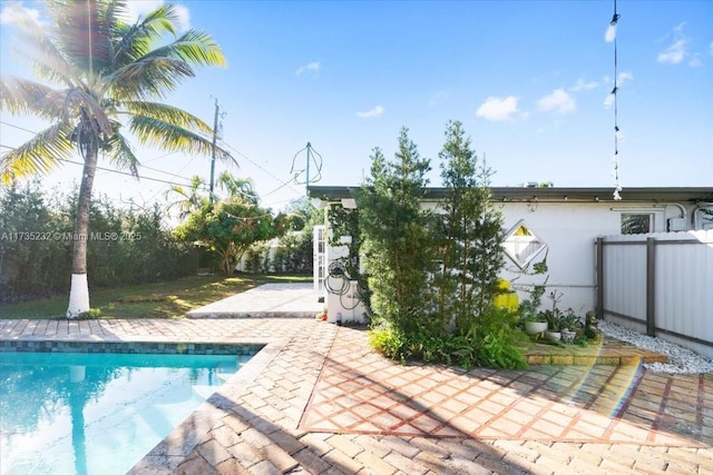 view of swimming pool with a patio area