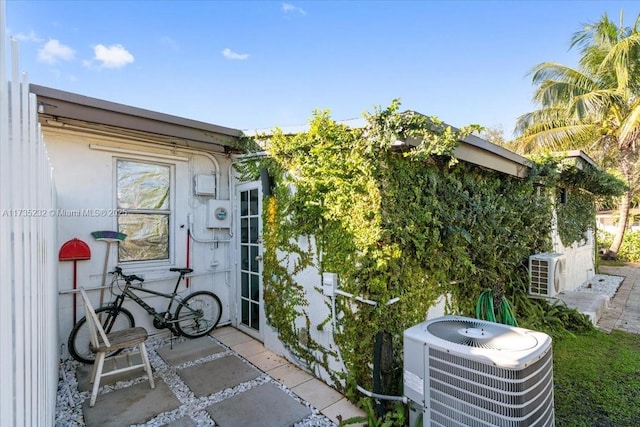 exterior space featuring central AC, a patio, and ac unit