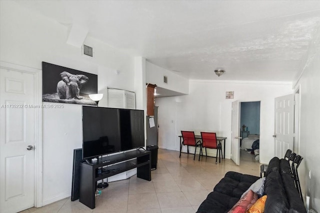 tiled living room with vaulted ceiling