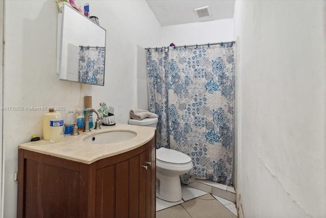 bathroom featuring vanity, a shower with shower curtain, tile patterned floors, and toilet