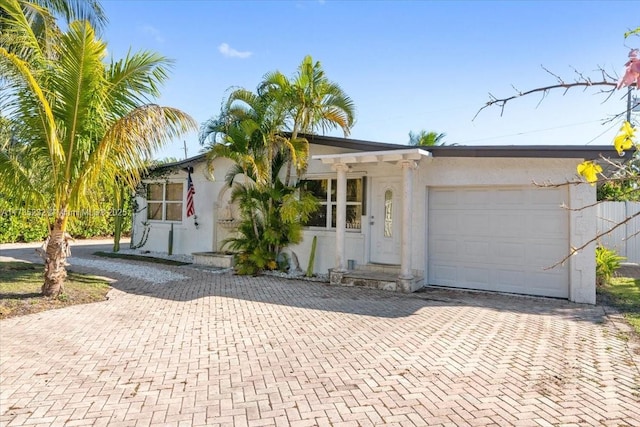 ranch-style home with a garage