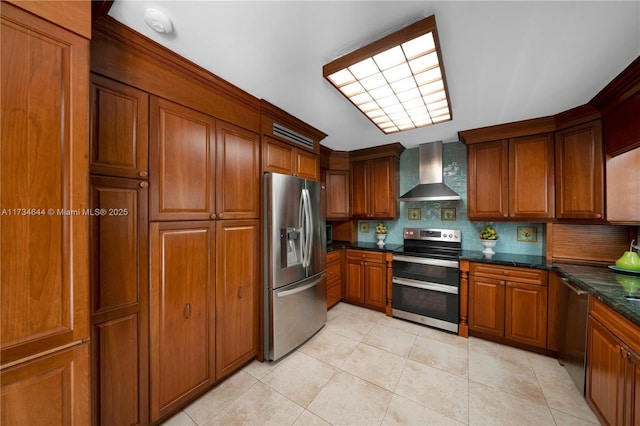 kitchen with wall chimney range hood, decorative backsplash, stainless steel appliances, and light tile patterned floors