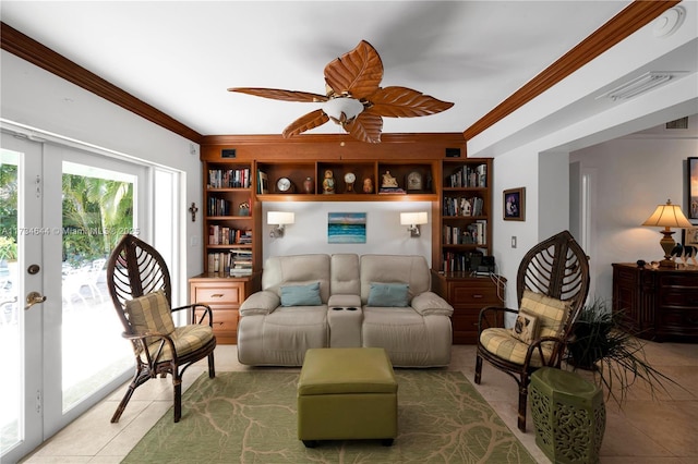 tiled living room featuring french doors, ceiling fan, and ornamental molding