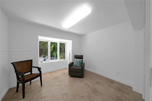 sitting room with light tile patterned floors