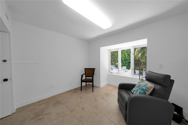 living area with light tile patterned flooring