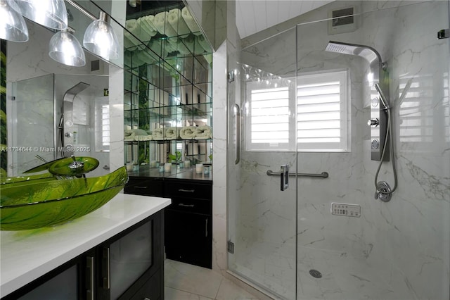 bathroom with vanity and a shower with shower door