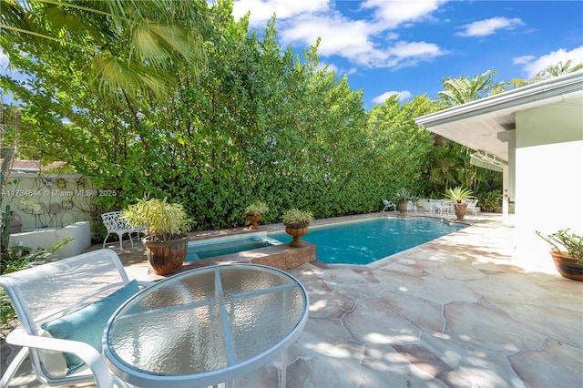 view of swimming pool featuring a patio