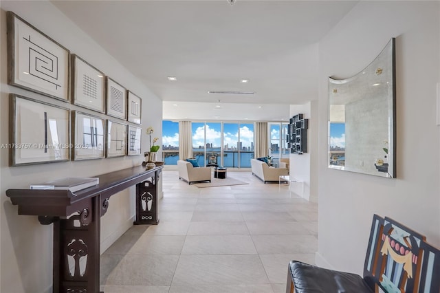 hall featuring light tile patterned flooring