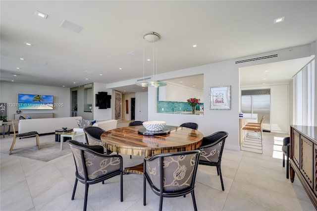 dining space with light tile patterned flooring