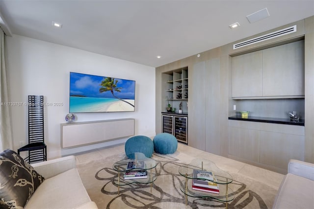 living room with bar, wine cooler, and built in shelves