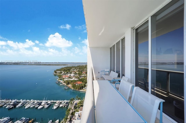 balcony featuring a water view