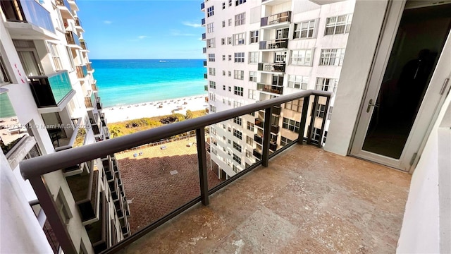 balcony with a view of the beach and a water view