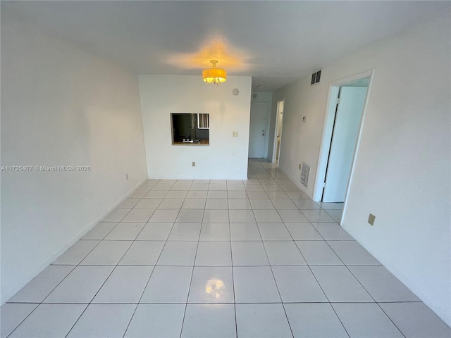 empty room featuring light tile patterned floors