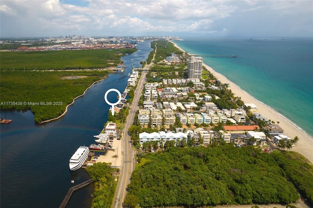 aerial view featuring a view of the beach and a water view